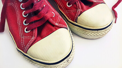 Image showing Old crimson sneakers, close-up
