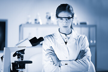 Image showing Portrait of a attractive, young, confident female health care professional in hes working environment. Blue toned black and white image