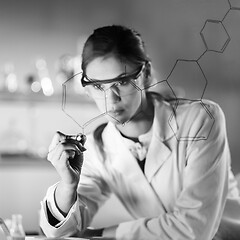 Image showing Portrait of a confident female researcher in life science laboratory writing structural chemical formula on a glass board.