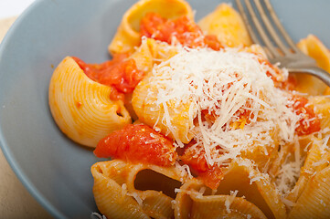 Image showing Italian snail lumaconi pasta with tomatoes