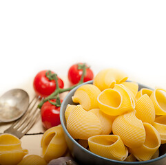 Image showing Italian snail lumaconi pasta with tomatoes