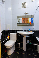 Image showing Classic bathroom interior in an apartment for daily rent, view of the toilet and washbasin