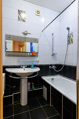 Image showing Classic bathroom interior in an apartment, with black and white tiles