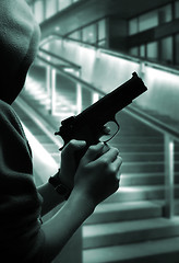 Image showing Boy with a gun at street at night