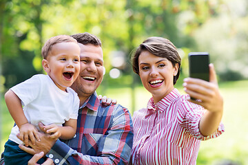 Image showing happy family taking selfie at summer park