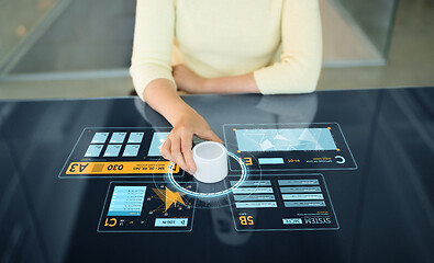 Image showing woman with control knob on interactive panel