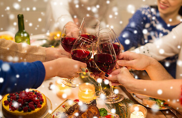 Image showing close up of friends with wine celebrate christmas