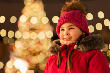 Image showing happy little girl at christmas market in winter