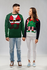 Image showing happy couple at christmas ugly sweater party