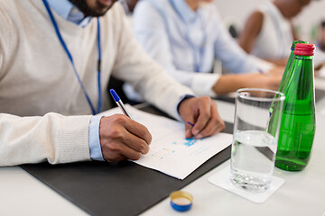 Image showing businessman with papers at business conference