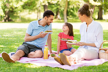 Image showing happy family having picnic at summer park