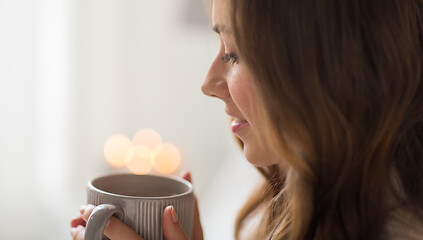 Image showing close up of happy woman with cup of coffee at home