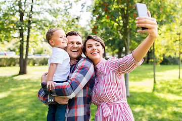 Image showing happy family taking selfie at summer park