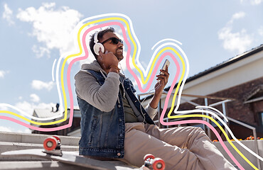 Image showing man with smartphone and headphones on roof top