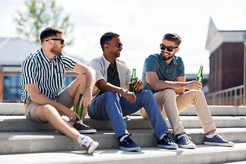Image showing happy male friends drinking beer on street