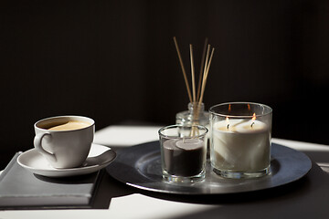 Image showing coffee, candles and aroma reed diffuser on table