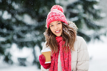 Image showing happy teenage girl with coffee in winter park