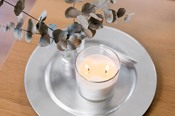 Image showing burning white candles on table at cozy home