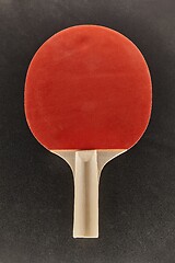 Image showing Pingpong racket on dark surface