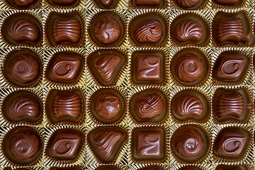 Image showing Open box of chocolate treets