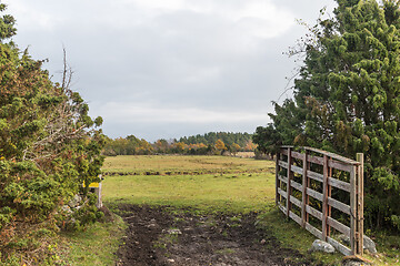 Image showing Open gate into a fall colored landscape