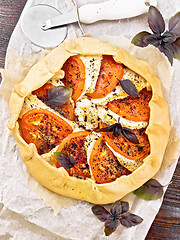 Image showing Galeta with tomato and cheese on wooden board top