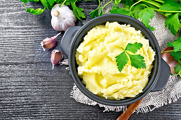 Image showing Potatoes mashed in saucepan on board top