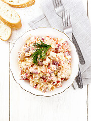 Image showing Salad with chicken and vegetables in plate on light board top