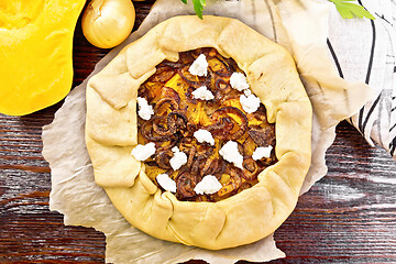 Image showing Pie with pumpkin and onions on parchment top