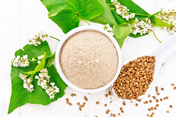 Image showing Flour buckwheat brown in bowl on white board top