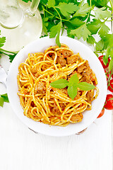 Image showing Spaghetti with bolognese in plate on board top