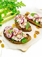 Image showing Bruschetta with fish and curd on white board