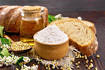 Image showing Flour buckwheat green in bowl with bread on board