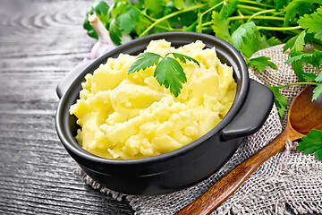 Image showing Potatoes mashed in saucepan on black board