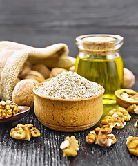 Image showing Flour walnut in bowl on wooden board