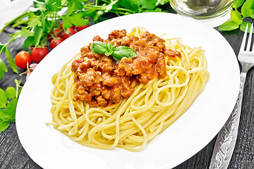 Image showing Spaghetti with bolognese on dark board