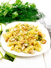 Image showing Fusilli with chicken and zucchini in plate on light board