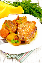 Image showing Chicken roast with pumpkin and dried apricots on napkin