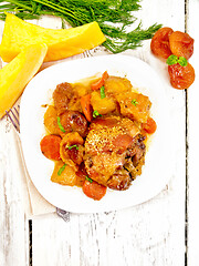 Image showing Chicken roast with pumpkin and dried apricots on board top