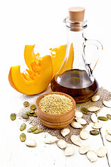 Image showing Flour pumpkin in bowl on white wooden board