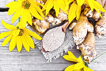 Image showing Flour of Jerusalem artichoke in spoon on old board top