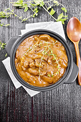 Image showing Goulash of beef in pan on wooden board top