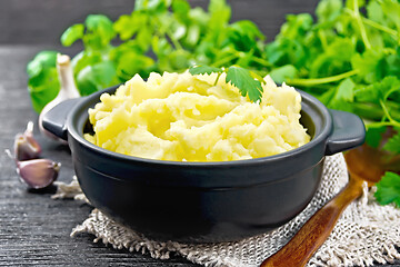 Image showing Potatoes mashed in saucepan on burlap