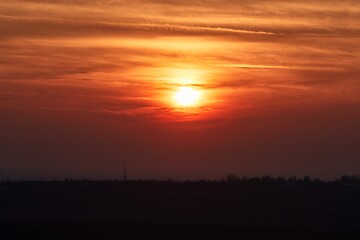 Image showing Sunset through cloudy red sky