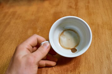 Image showing Running out of coffee, empty cup