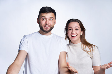 Image showing Happy surprised young couple in amazement