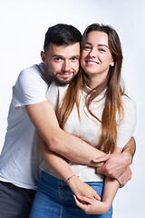 Image showing Smiling young couple hugging