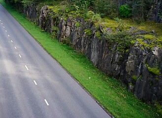 Image showing asphalt road along the cliff and forest 