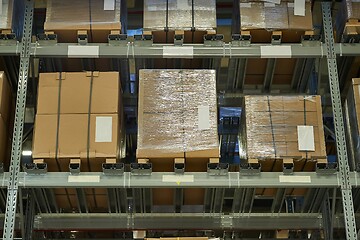 Image showing Warehouse with stocked shelves of boxes