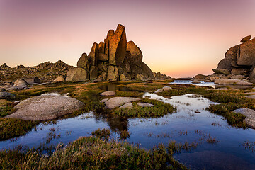 Image showing Rocky Tor in Snowy Mountains surrounded by blue pools